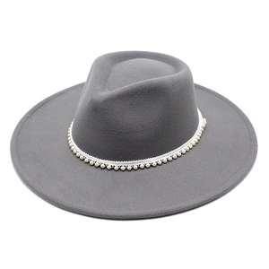 Close-up of grey wool jazz hat featuring elegant pearl bead trim around the crown