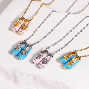 Detail of ballet slippers pendants in pink and blue enamel on gold and silver O-chains