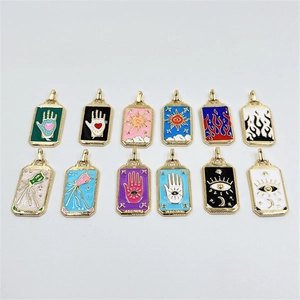 Set of 12 gold enamel tarot pendants featuring evil eye and celestial patterns