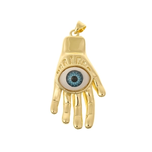 Golden Hamsa Hand pendant with a blue Evil Eye zircon inlay on a white background