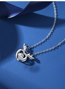 Macro shot of silver deer antler heart pendant with sparkling round zircon stone