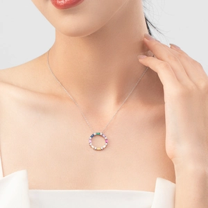 Elegant S925 sterling silver necklace with a circular pendant featuring colorful zircons