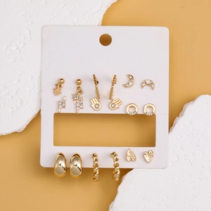 Golden moon and heart earring set featuring nine pairs of rhinestone stud and hoop earrings