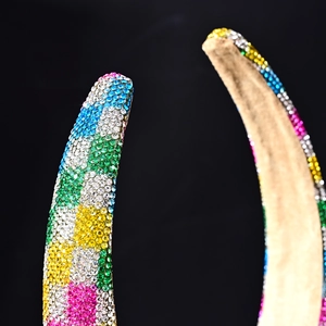 Macro shot of colorful rhinestone headband with vibrant plaid and stripe patterns