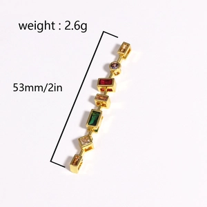 Detail of gold pendant with colorful zircons showing 53mm length and 2.6g weight