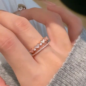 Rose gold double-layer open ring featuring zircon pave and heart mother-of-pearl charms