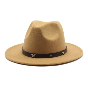 Detail of camel wool fedora hat featuring black leather band and silver star studs