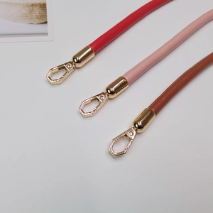 Three premium leather shoulder straps in red, pink, and brown with gold metal buckles