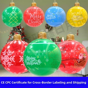 Macro view of colorful Merry Christmas inflatable balls with festive patterns and gold loops