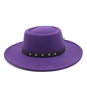 Close-up of deep purple wool fedora featuring black leather band and silver star studs