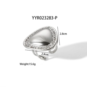 Macro detail of silver triangle ring with rhinestones showing dimensions 2.8cm and 15.6g weight