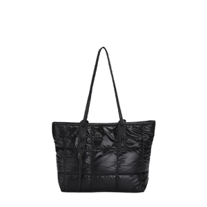 Black quilted puffer tote bag with large square stitching and glossy finish on white background