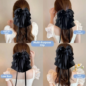 French style black chiffon bow hair clip with long ribbons shown in four hairstyles