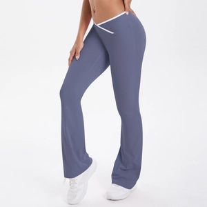 Detail of V-shaped crossover high waist yoga pants with white trim and flared hem
