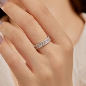 Close-up of S925 sterling silver ring featuring three rows of sparkling pavé diamonds