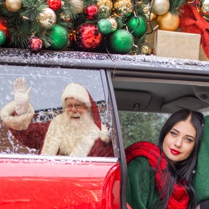 Santa Claus waving vinyl window sticker on red car rear window for Christmas decor