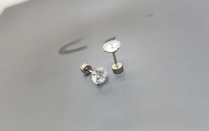 Macro shot of 316L stainless steel stud earrings with clear round cut zircon and screw back