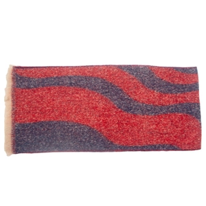 Close-up of red and blue wavy pattern scarf with soft textured tassels on white background