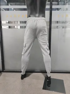 Rear view of men's grey fleece cargo joggers showing the back pocket and elastic cuffs
