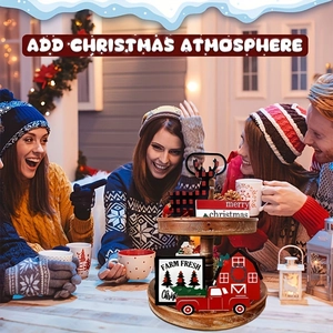 Detail of wooden tiered tray Christmas decor with rustic reindeer, barn, and truck signs