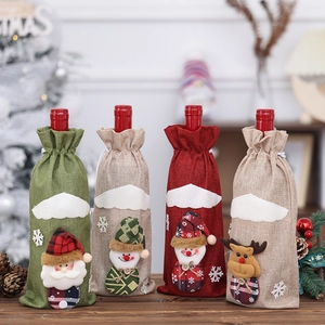 Linen Christmas wine bottle covers featuring Santa, Snowman and Reindeer designs