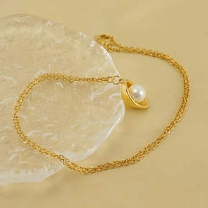 18k gold plated stainless steel necklace with round pearl in gold ingot pendant