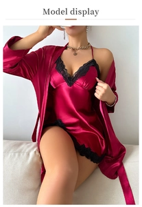Detail of red satin nightgown with black lace trim and matching robe for women