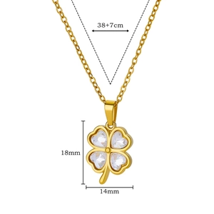 Detailed view of gold clover pendant with clear cubic zirconia heart crystals and dimensions