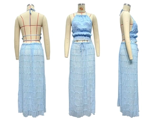 Detailed views of light blue tiered ruffle maxi skirt and halter backless crop top set