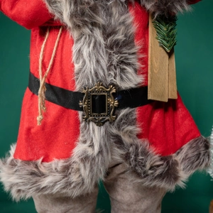Classic red Santa Claus doll with skateboard, felt texture, and golden buckle detail