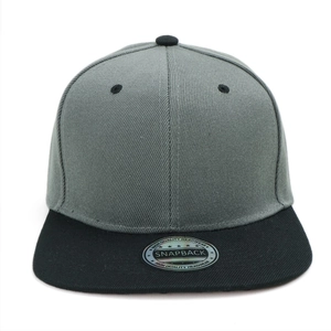 Detail view of two-tone snapback cap with silver quality seal and breathable eyelets