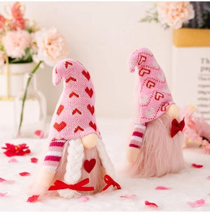 Detail of pink Valentine's gnomes with knitted heart hats and plush beard textures