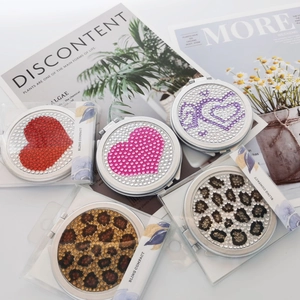 Sparkly rhinestone compact mirror in multiple patterns with elegant folding design