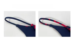 Detail of dark blue bikini straps featuring red star prints and thin cord design