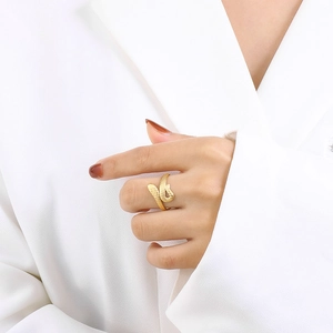 Macro detail of snake-skin texture and gold-plated finish on adjustable open ring