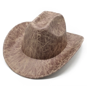 Vintage brown faux suede cowboy hat with distressed crackle texture and wide brim