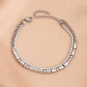 Detail of double-layer gold Morse code bracelet with sparkling crystals and lobster clasp