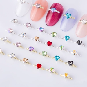 Colorful heart nail charms with metallic rope borders shown in a multi-color collection