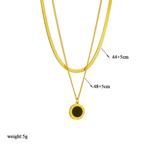 Gold double-layered necklace with snake chain and black Roman numeral pendant charm