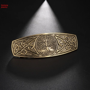Macro shot of bronze tree of life barrette featuring intricate Celtic knot patterns