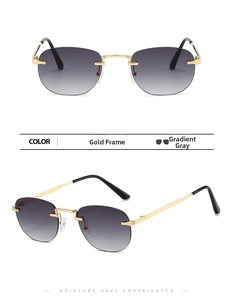 Detail view of rimless oval sunglasses with gold metal temples and gradient gray lenses