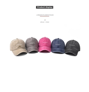Row of five washed cotton baseball caps with mama embroidery in various colors