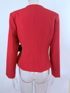 Back view of a red tailored blazer with princess seams and slim fit silhouette