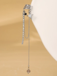 Detail of silver tassel ear cuff featuring stars, rhinestones and translucent beads