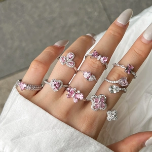 Elegant S925 silver ring set with pink heart and butterfly crystals worn on hand