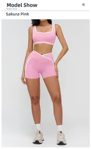 Detail view of cherry blossom pink yoga set with white contrast piping and V-cross waistband