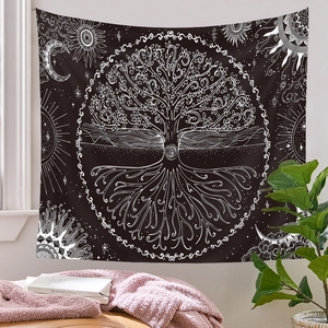 Detail of bohemian black and white Tree of Life tapestry with sun and moon for wall decor