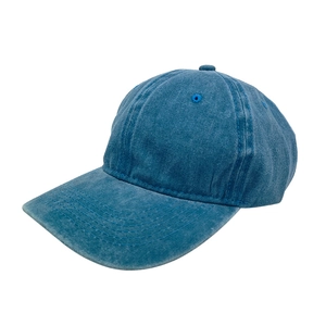 Detailed texture of washed blue cotton fabric on a six-panel baseball cap crown