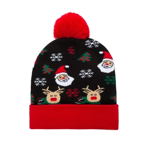 Bonnet de Noël tricoté noir et rouge avec motifs de Père Noël, rennes et pompon doux