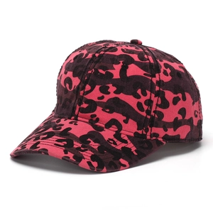 Detail view of pink and brown leopard print cotton baseball cap with curved brim texture